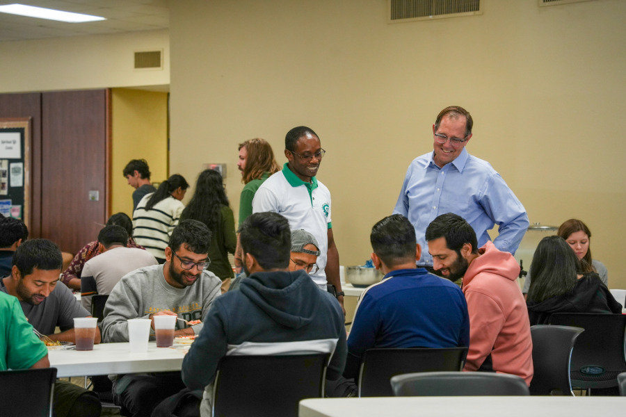 Graduate students eating lunch together