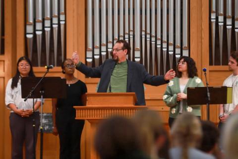 Carlos Colón leading a worship service