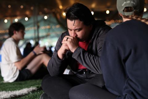A student praying at FM72