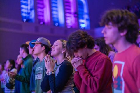 Students worshipping in Waco Hall