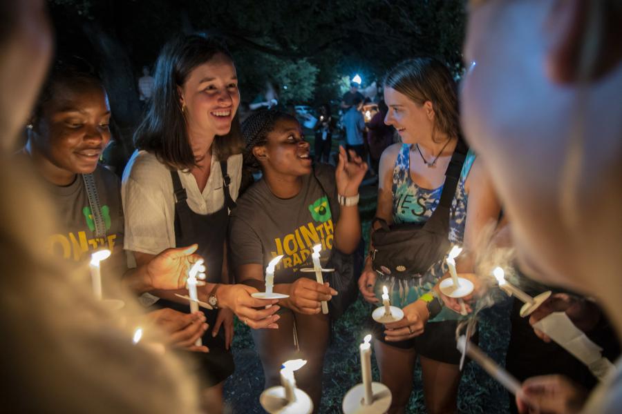 Students with candles at a Spiritual Life gathering